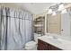 Compact bathroom featuring a vanity, toilet, and shower with curtain, offering essential functionality at 121 Fort Jackson Rd, Morrisville, NC 27560