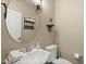 Cozy half bathroom features a decorative mirror, storage shelves, and a pedestal sink at 121 Fort Jackson Rd, Morrisville, NC 27560