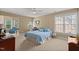 Cozy bedroom boasts a ceiling fan, carpet, and a sunny seating area at 121 Fort Jackson Rd, Morrisville, NC 27560