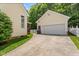 Long driveway leading to a two-car garage and side entrance of the house at 121 Fort Jackson Rd, Morrisville, NC 27560