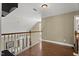 Hallway features hardwood floors, stairway, and natural light from windows at 121 Fort Jackson Rd, Morrisville, NC 27560