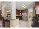 Open kitchen with stainless steel appliances, dark cabinets, and granite countertops at 121 Fort Jackson Rd, Morrisville, NC 27560
