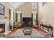 Cozy living room with tall ceilings, a fireplace, and comfortable seating for relaxation at 121 Fort Jackson Rd, Morrisville, NC 27560