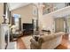Bright living room with soaring ceilings, a fireplace, and a comfortable seating area at 121 Fort Jackson Rd, Morrisville, NC 27560