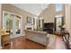 Inviting living room with high ceilings, a fireplace, and a large glass door to the backyard at 121 Fort Jackson Rd, Morrisville, NC 27560