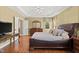 Main bedroom boasts hardwood floors, a tray ceiling, and a large window at 121 Fort Jackson Rd, Morrisville, NC 27560