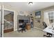 Office features carpet, desk, and natural light from the window, with stairs in the background at 121 Fort Jackson Rd, Morrisville, NC 27560