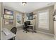 Carpeted office featuring a desk, large windows, and neutral paint at 121 Fort Jackson Rd, Morrisville, NC 27560