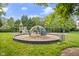 Community playground with green space and various play structures for children at 121 Fort Jackson Rd, Morrisville, NC 27560