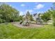 Community playground with swings, slides, and climbing dome for children to enjoy at 121 Fort Jackson Rd, Morrisville, NC 27560