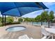 Community pool and hot tub with shade, tables, and lounge chairs available at 121 Fort Jackson Rd, Morrisville, NC 27560