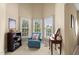 Comfortable sitting room with a plush armchair, ample natural light, and neutral decor at 121 Fort Jackson Rd, Morrisville, NC 27560