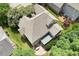 An aerial view highlights the home's layout, screened porch, deck, patio, and landscaping at 1211 E Pointe Dr, Durham, NC 27712