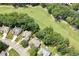 An aerial view of beautiful homes surrounding a lush green golf course at 1211 E Pointe Dr, Durham, NC 27712