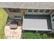 Aerial view shows the back of the house with deck, hot tub, and stone patio at 1211 E Pointe Dr, Durham, NC 27712