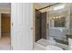 Modern bathroom with a walk-in shower featuring sliding glass doors and tile surround at 1211 E Pointe Dr, Durham, NC 27712