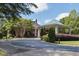 A beautifully landscaped clubhouse entrance with portico and stone accents at 1211 E Pointe Dr, Durham, NC 27712