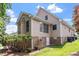An exterior view reveals architectural details, the two-story structure, and the well-kept yard at 1211 E Pointe Dr, Durham, NC 27712