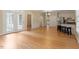 Spacious living room with hardwood floors and bright natural light from French doors at 1211 E Pointe Dr, Durham, NC 27712