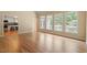 Living room with hardwood floors and an open view of the kitchen and backyard at 1211 E Pointe Dr, Durham, NC 27712