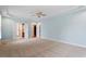 Large main bedroom featuring a tray ceiling, ceiling fan and carpet flooring at 1211 E Pointe Dr, Durham, NC 27712