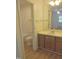 Bathroom boasts a single vanity, white countertop, shower and tub combo, and access to the bedroom at 1402 Barton Place Dr, Raleigh, NC 27608