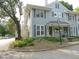 Two-story home with blue siding, black shutters, manicured landscaping, and covered entryways at 1402 Barton Place Dr, Raleigh, NC 27608