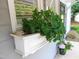 Exterior shows a window box with flowers at the front of the home at 1402 Barton Place Dr, Raleigh, NC 27608