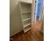 Hallway featuring wood floors and a built in shelf on the wall at 1402 Barton Place Dr, Raleigh, NC 27608