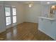 Bright living room with hardwood floors, ceiling fan, and sliding door access to the outside at 1402 Barton Place Dr, Raleigh, NC 27608