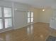 Spacious living room featuring hardwood floors, ceiling fan, and lots of natural light at 1402 Barton Place Dr, Raleigh, NC 27608