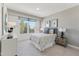 Comfortable bedroom with carpet, bedside table, and large window at 144 N White St # 100, Wake Forest, NC 27587