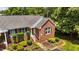 Charming brick home with a well-manicured front yard and inviting entrance at 1731 Malone Rd # A, Burlington, NC 27215