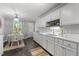 Bright, practical kitchen with white cabinets, laminate flooring, and lots of counter space at 1731 Malone Rd # A, Burlington, NC 27215