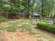 Backyard featuring a stone path and small wood deck at 1913 Rendall St, Burlington, NC 27215