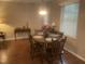 Charming dining area with natural light, classic table and chairs, and warm decor at 1913 Rendall St, Burlington, NC 27215