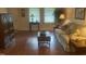 Comfortable living room featuring a sofa, stylish tables, and lots of natural light through the windows at 1913 Rendall St, Burlington, NC 27215