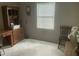 Office space features a built in desk, a bright window, and a small seating area at 1913 Rendall St, Burlington, NC 27215