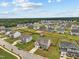Aerial view of neighborhood showcasing the large properties, and green landscape at 200 Cloud Berry Ln, Holly Springs, NC 27540
