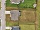 Aerial view of home with spacious backyard, neighboring houses, and tree lined property at 200 Cloud Berry Ln, Holly Springs, NC 27540