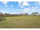 Spacious, green backyard fully fenced in, surrounded by neighboring properties at 200 Cloud Berry Ln, Holly Springs, NC 27540