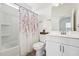 Bright bathroom featuring tile floors, shower/tub, vanity, and neutral walls at 200 Cloud Berry Ln, Holly Springs, NC 27540