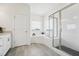 Bathroom with a shower, bathtub and bright natural light from the window at 200 Cloud Berry Ln, Holly Springs, NC 27540