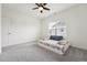 Neutral bedroom featuring a ceiling fan, one window with blinds, and a throw bed at 200 Cloud Berry Ln, Holly Springs, NC 27540