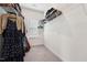 A walk-in closet with carpeted floors featuring wire shelving and clothing racks at 200 Cloud Berry Ln, Holly Springs, NC 27540