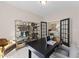 Bright office with double french doors, bookcase, and desk with chairs at 2012 Kapalua Way # 193, Durham, NC 27703