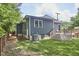 Stylish home featuring well-maintained lawn, back deck, and a sleek gray exterior at 2031 Englewood Ave, Durham, NC 27705