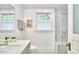 Bathroom showcasing a gray vanity with white countertops and a modern glass-enclosed shower at 2031 Englewood Ave, Durham, NC 27705