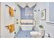 Modern bathroom with a freestanding tub, patterned tile, and glass shower enclosure at 2031 Englewood Ave, Durham, NC 27705