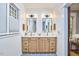 Bright bathroom featuring a double sink vanity with modern fixtures and stylish lighting at 2031 Englewood Ave, Durham, NC 27705